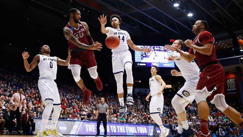 Dajuan Graf (No. 10) of North Carolina Central passes against Garrison Goode of UC Davis in the second half during their First Four game at UD Arena on Wednesday. Getty Images
