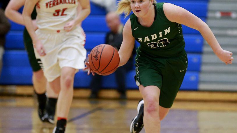 Badin’s Olivia Keene sprints down the court after a steal as Versailles’ Danielle Winner (32) trails Wednesday night during a Division III regional semifinal at Springfield. BILL LACKEY/STAFF