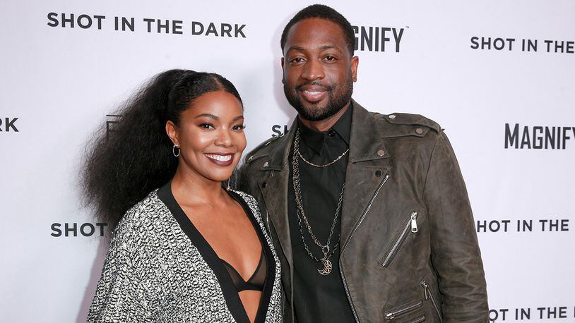 Gabrielle Union (L) and Dwyane Wade donated $200,000 to help send students to the March For Our Lives gun control rally in Washington D.C.  (Photo by Rich Fury/Getty Images)
