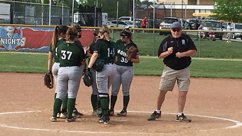 Badin coach Greg Stitzel comes out of a huddle with his team during a Division II district softball semifinal against Ross at Kings on May 15, 2018. Ross won 4-3 in 10 innings. RICK CASSANO/STAFF