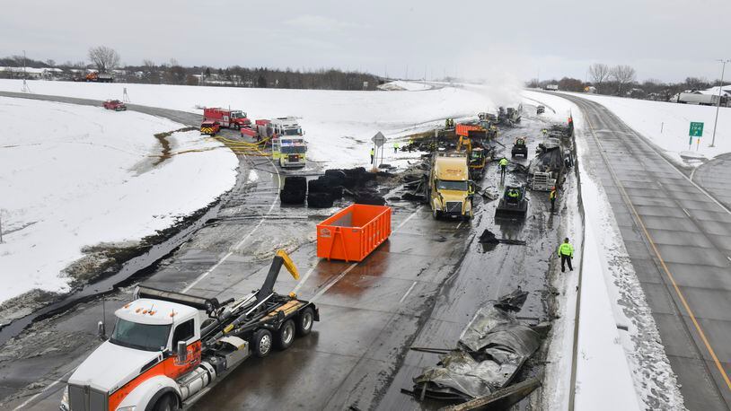 In this Nov. 12, 2020 file photo, the westbound lanes of Interstate Highway 94 are closed as crews remove vehicles and debris from the scene of a multi-vehicle accident near Monticello, Minn.  The smaller, lighter vehicles that women more often drive, and the types of crashes they get into, may explain why they are much more likely to suffer a serious injury in a collision than men, a new study published Thursday, Feb. 11, 2021 found.  (Dave Schwarz/St. Cloud Times via AP, File)