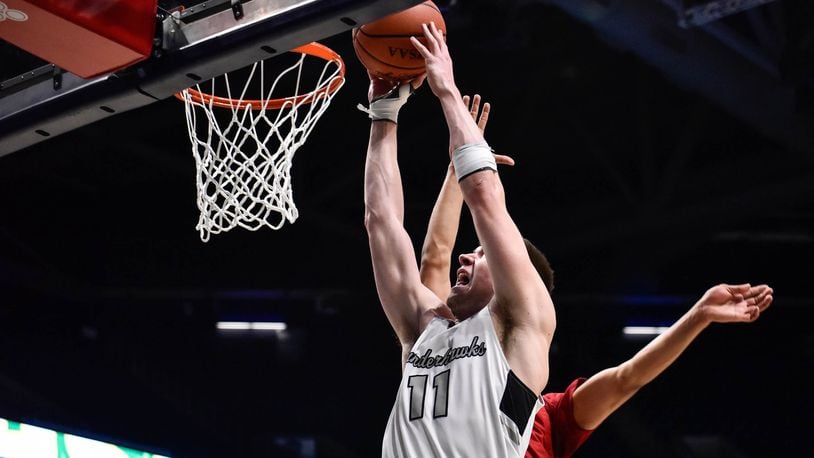Lakota East’s Alex Mangold puts up a shot Wednesday, March 11, 2020 in their Division I Regional boys basketball semifinal against La Salle at Xavier University’s Cintas Center. In an effort to reduce the risk of spreading coronavirus (COVID-19), players were allowed to designate 4 family members to purchase tickets for the game and coaching staff was allowed 2 family members each. NICK GRAHAM / STAFF