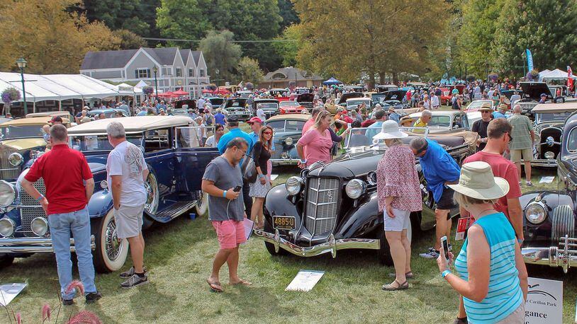 Spectators look over the 1935 Auburn 835 automobile at the 2019 Dayton Concours d’Elegance entered by Michael Mereness of Cincinnati. Photo by Haylie Schlater