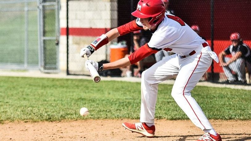 Madison’s Jake Edwards puts down a sacrifice bunt during an April 26 game against Carlisle in Madison Township. The host Mohawks won 3-1. NICK GRAHAM/STAFF
