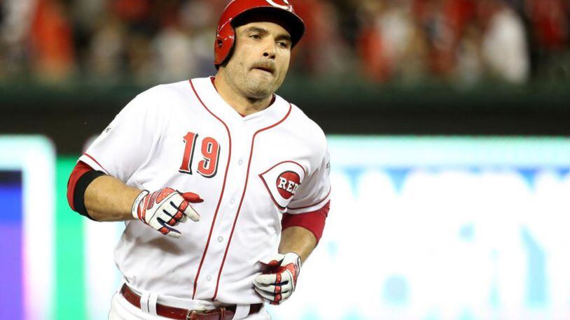 Reds first baseman Joey Votto traded shirts with a fan in Pittsburgh on Monday.