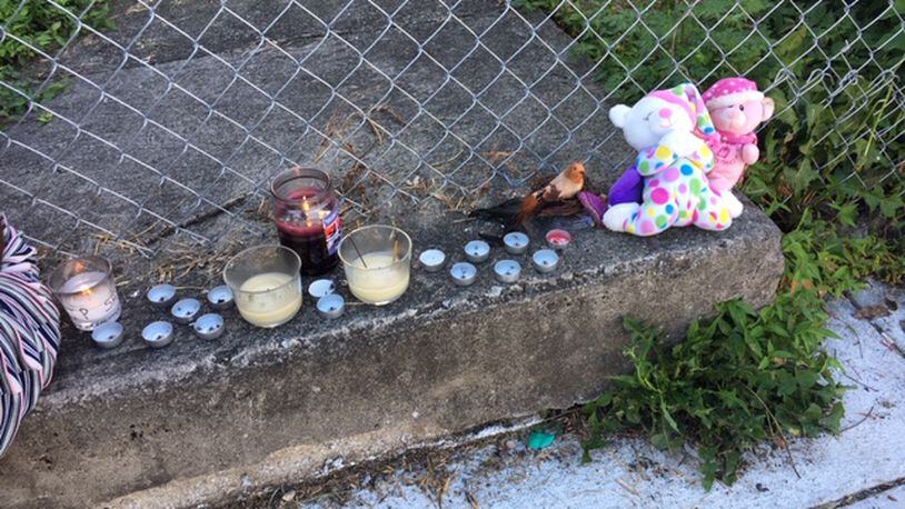 A makeshift memorial near where Shon Walker was shot and killed on East Avenue Thursday night