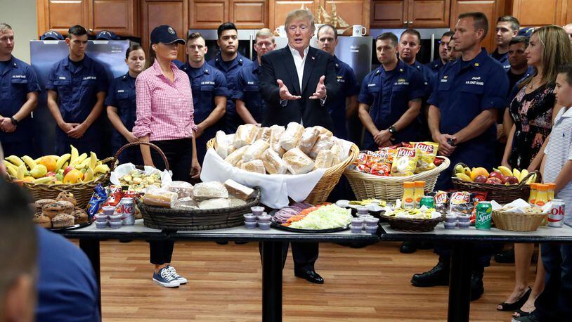 President Donald Trump, with first lady Melania Trump, speaks to members of the U.S. Coast Guard, at the Lake Worth Inlet Station, on Thanksgiving, Thursday, Nov. 23, 2017, in Riviera Beach, Fla. (AP Photo/Alex Brandon)