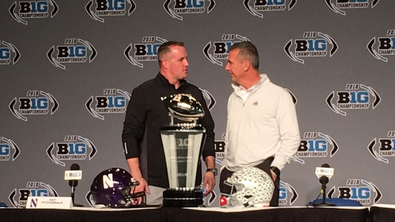Urban Meyer and Pat Fitzgerald talk during a press conference Friday afternoon in Indianapolis to preview the Big Ten championship game.