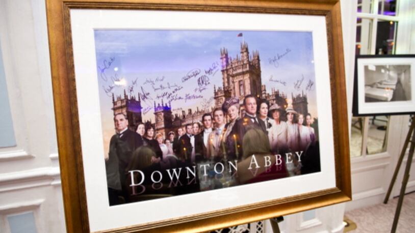 LONDON, ENGLAND - JULY 14: (EXCLUSIVE COVERAGE)   A signed and framed poster of Downton Abbey awaits auction during 'An Evening With Downton Abbey - Raising Money For Merlin - The Medical Relief Charity' at The Savoy Hotel on July 14, 2011 in London, United Kingdom. (Photo by Ian Gavan/Getty Images)