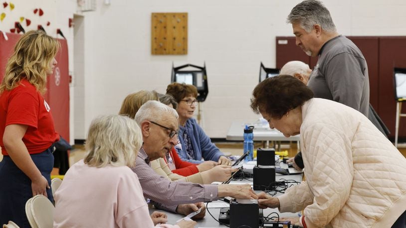 Poll workers check in residents to vote at Elda Elementary School Tuesday, May 2, 2023 in Ross Twp. Residents were voting on a levy for Ross schools. NICK GRAHAM/STAFF