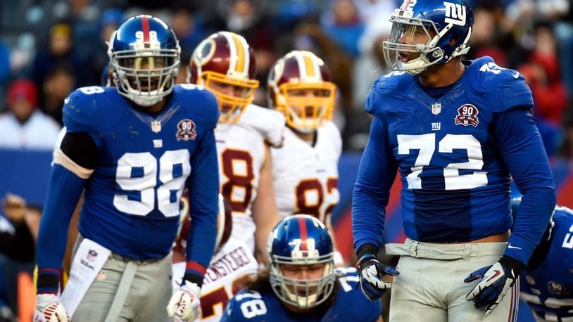 EAST RUTHERFORD, NJ - DECEMBER 14: Kerry Wynn #72 of the New York Giants celebrates a stop against the Washington Redskins during their game at MetLife Stadium on December 14, 2014 in East Rutherford, New Jersey. (Photo by Alex Goodlett/Getty Images)