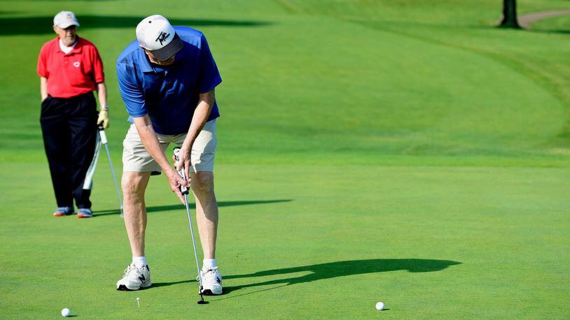 Joe Wermes putts Friday morning, May 26, on the green of hole 9 during a Senior Scramble at Twin Run in Hamilton. The city-owned golf course has seen “an uptick” in the number of tee times scheduled this season, likely due to the closure of Weatherwax Golf Course.