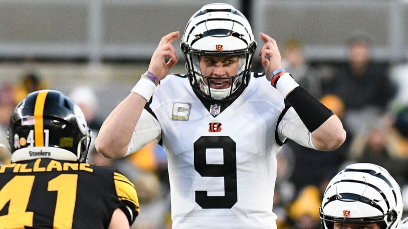 Cincinnati Bengals quarterback Joe Burrow (9) calls signals against the Pittsburgh Steelers during the first half of an NFL football game, Sunday, Nov. 20, 2022, in Pittsburgh. (AP Photo/Don Wright)