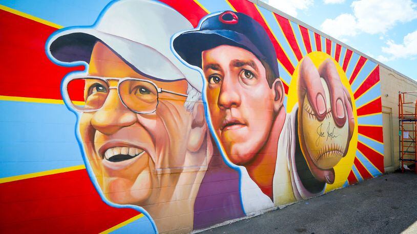The StreetSpark program created this Hamilton mural featuring Cincinnati Reds legend, Joe Nuxhall, on the side of Clark’s Sporting Goods on Hamilton’s West Side. GREG LYNCH / STAFF