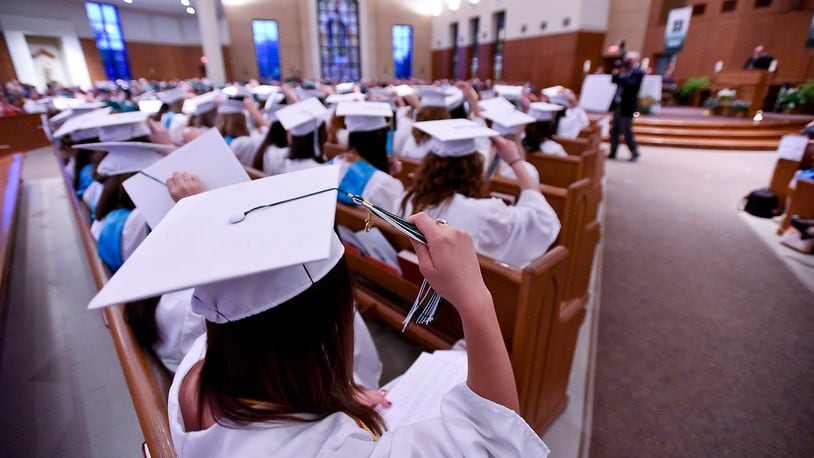 Graduating seniors across Butler County have until Jan. 7, 2024, to fill out the Hamilton Community Foundation's universal scholarship application. Pictured is a file photo from a previous Hamilton Badin graduation ceremony. In the file photo, Sarah Rieman and the rest of the 2015 graduation class move their tassels to the right during Stephen T. Badin High School's Forty-ninth Annual Commencement ceremony Friday, May 29, 2015, at St. Maximilian Kolbe Catholic Church in Liberty Township. NICK GRAHAM/FILE