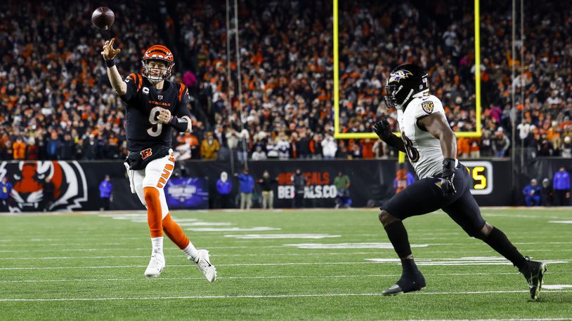 Bengals quarterback Joe Burrow throws a two-point conversion to Tee Higgins during Cincinnati's Wild Card playoff game against the Baltimore Ravens Sunday, Jan. 15, 2023 at Paycor Stadium in Cincinnati. The Bengals won 24-17. NICK GRAHAM/STAFF