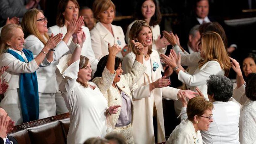 Members of Congress cheer after President Donald Trump acknowledges more women in Congress during his State of the Union address to a joint session of Congress on Capitol Hill in Washington, Tuesday, Feb. 5, 2019.
