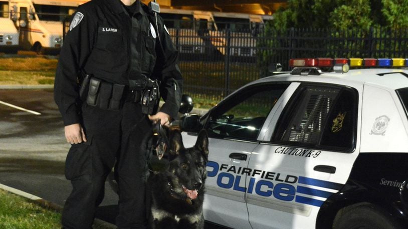 Fairfield Police Officer Sam Larsh is the newest K-9 handler for the city of Fairfield. He and his partner, Scout, a black German Shepherd, is the third active K-9 unit for the city police department. MICHAEL D. PITMAN/STAFF