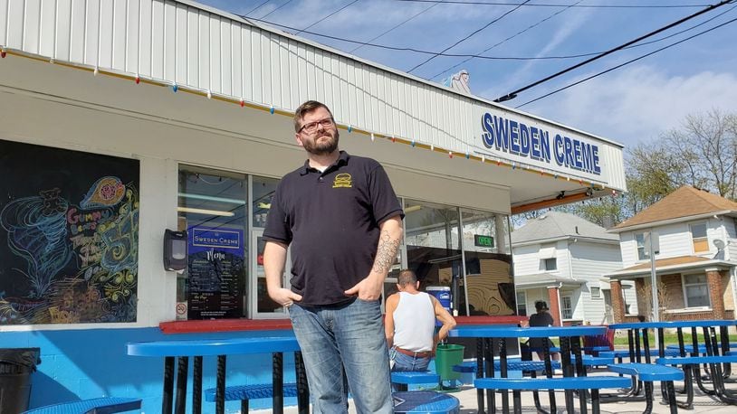 Sweden Creme owner Teddy Young stands outside the business at 2047 Pleasant Ave. in Hamilton's Lindenwald neighborhood. ERIC SCHWARTZBERG/STAFF