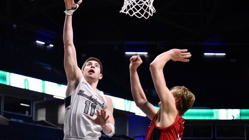 Lakota East’s Alex Mangold puts up a shot Wednesday, March 11, 2020 in their Division I Regional boys basketball semifinal against La Salle at Xavier University’s Cintas Center. NICK GRAHAM / STAFF