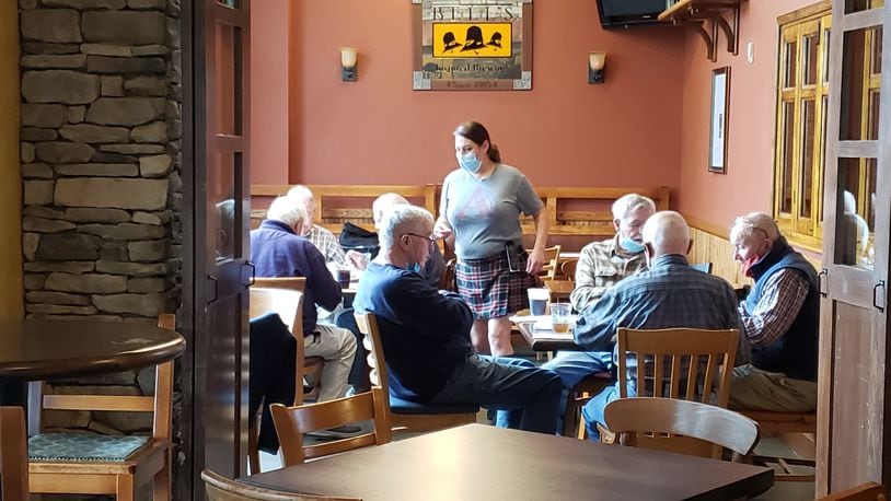 At least six tables of customers gather at Dingle House Irish Pub & Grub in West Chester Twp. before noon to partake of the restaurant's temporarily pared down menu. CONTRIBUTED