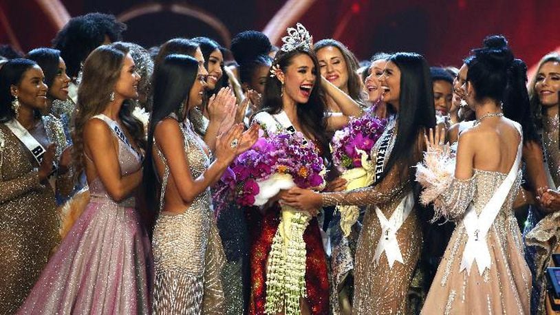 Contestants congratulate new Miss Universe Catriona Gray, center, from Philippines during the final round of 67th Miss Universe competition in Bangkok, Thailand, Monday, Dec. 17, 2018.