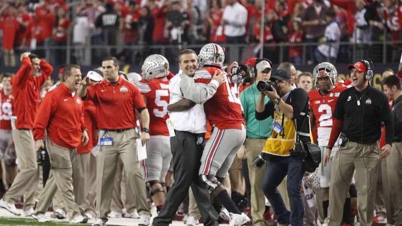 Ohio State coach Urban Meyer and quarterback Cardale Jones hug in the final minute of Ohio State’s 42-20 victory over Oregon in the national championship game on Monday, Jan. 12, 2015, at AT&T Stadium in Arlington, Texas. David Jablonski/Staff