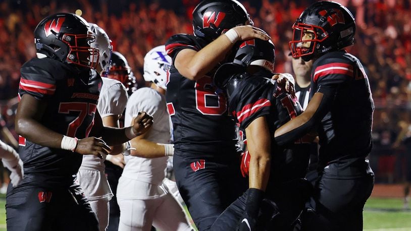 Lakota West celebrates a touchdown in Friday's season-opening win over St. Xavier. Nick Graham/STAFF