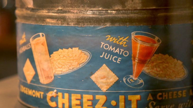 The Cheez-It cracker was invented in Dayton in 1921 by the Greene & Greene Company. This snack can, circa 1929, is on display at Carillon Historical Park.  LISA POWELL / DAYTON DAILY NEWS