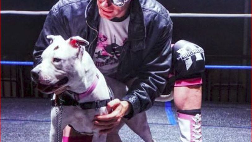 As part of the “Clotheslines, Canines and Felines” effort, FGW wrestlers have posed with animals from the Animal Adoption Foundation no-kill shelter for a calendar whose proceeds go to the shelter. PROVIDED