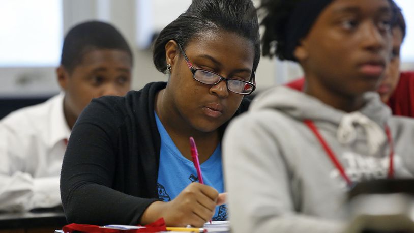 Ta'nesha Holden, 17, takes notes during the Montgomery County YouthWorks Summer Program at Pontiz Career Technology Center where instructor Mark Anderson teaches job readiness skills through Montgomery County Workforce Development.  TY GREENLEES / STAFF