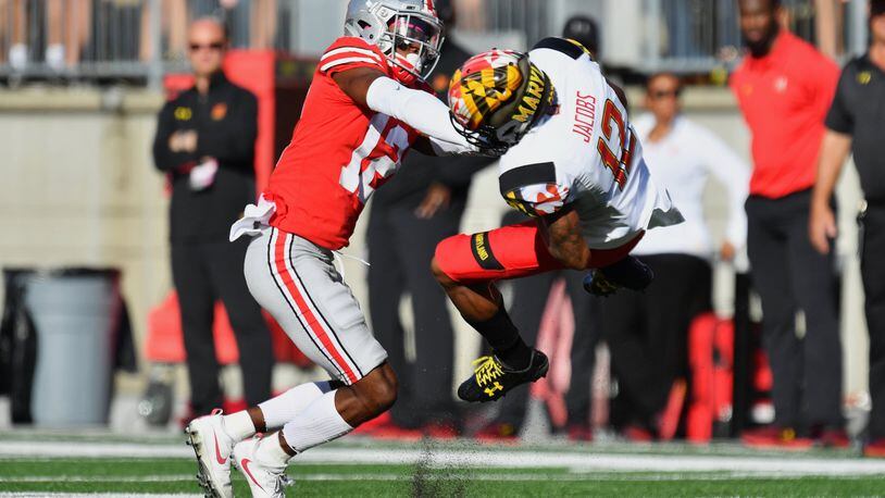 Ohio State’s Denzel Ward hits Maryland’s Taivon Jacobs after a reception in the first quarter at Ohio Stadium on October 7, 2017 in Columbus, Ohio. Ward was ejected from the game after being assessed a targeting penalty for the hit. (Photo by Jamie Sabau/Getty Images)