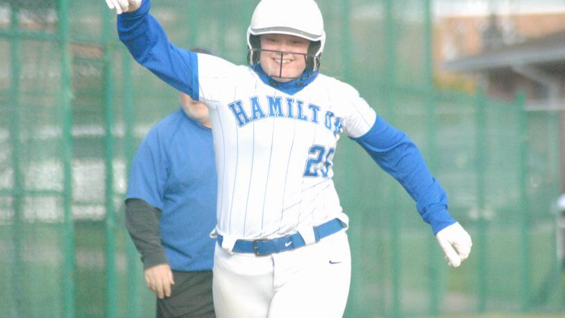 Hamilton junior Maddie Hall rounds third after hitting a three-run homer against Middletown on Monday. Chris Vogt/CONTRIBUTED