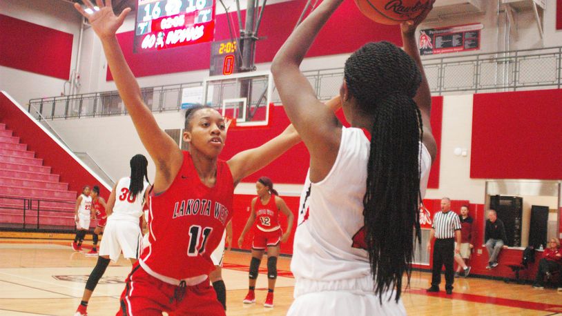 Lakota West’s Dominique Camp (11) defends an inbounds pass from Fairfield’s Zaria Black (2) on Dec. 1, 2018, at the Fairfield Arena. Fairfield won 53-48. RICK CASSANO/STAFF