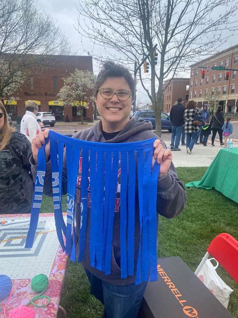 Shana Rosenberg demonstrates part of the t-shirt yarn-making process at Earth Fest. She said in a Facebook post it was great sharing the park with so many other great organizations working on sustainability. CONTRIBUTED