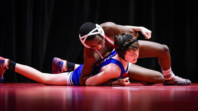 Fairfield’s Moustapha Bah is en route to a 106-pound victory over Springboro’s Michael Gust during a dual Jan. 19 at Fairfield’s Performing Arts Center. NICK GRAHAM/STAFF