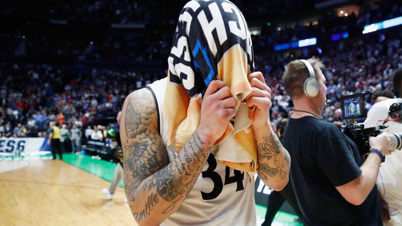 NASHVILLE, TN - MARCH 18:  Jarron Cumberland #34 of the Cincinnati Bearcats reacts after falling to the Nevada Wolf Pack during the second half in the second round of the 2018 Men's NCAA Basketball Tournament at Bridgestone Arena on March 18, 2018 in Nashville, Tennessee.  (Photo by Andy Lyons/Getty Images)