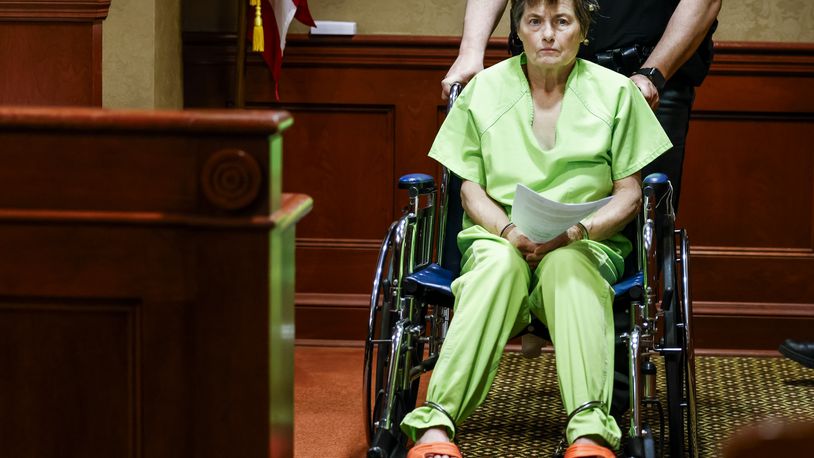 Pamela Harville is wheeled into the courtroom of Butler County Common Pleas Judge Dan Haughey for her arraignment on multiple charges for the shooting death of her husband David Harville Thursday, April 11, 2024 in Hamilton. NICK GRAHAM/STAFF  