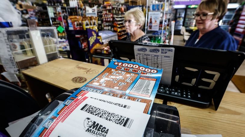 FILE PHOTO: Mega Millions lottery sales are brisk at Bee-Gee Market on Bigger Road in Kettering Thursday, July 28, 2022. If there's a winner on Friday, the payout will be over a billion dollars. JIM NOELKER/STAFF