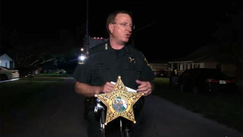 Polk County, Florida, Sheriff Grady Judd briefs reporters after deputies said one man was killed and two others injured during an argument over a dog.