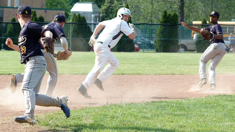 New Miami’s Ronnie Bowman gets chased by Lockland’s Kyle Runk (22) in a rundown that includes Jakob Harper (19) and Lyndon Betts (10) during Wednesday’s Division IV sectional baseball game at New Miami. The host Vikings won 8-1. RICK CASSANO/STAFF