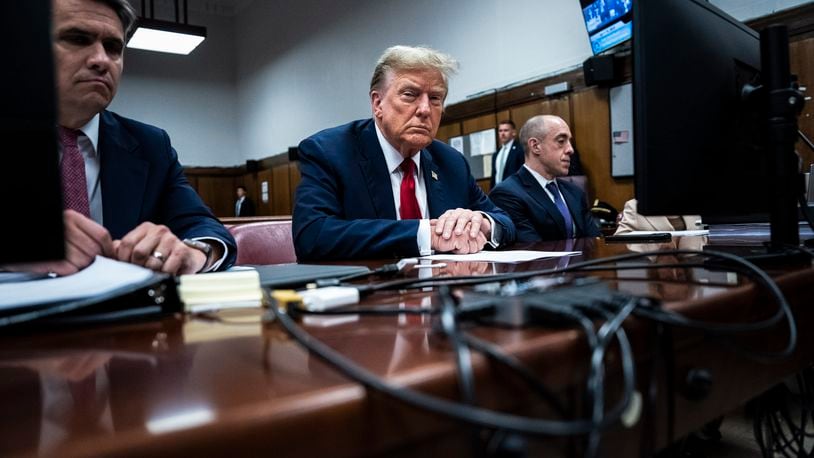 FILE - Former President Donald Trump sits in Manhattan criminal court with his legal team in New York, April 15, 2024. A new AP-NORC Center for Public Affairs Research poll found that only about one-third of U.S. adults think Trump did something illegal in the hush money case for which jury selection began Monday, while close to half think he did something illegal in the other three criminal cases pending against him. Still, about half of Americans would consider Trump unfit to serve as president if he is convicted. (Jabin Botsford/Pool Photo via AP)