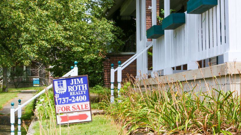 Two homes for sale along D Street in Hamilton, Monday, Aug. 7, 2017. Home sales, for Butler County and the region are continuing to hold steady through the first half of the year. Butler County saw 2,490 sales in 2017, compared to 2,489 in the first half of 2017. GREG LYNCH / STAFF