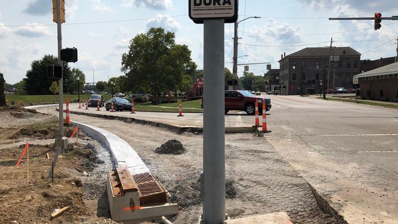A new dedicated right-turn lane is being added that will ease traffic congestion for westbound vehicles on Hamilton's High-Main bridge onto North B Street and the future Spooky Nook Sports Champion Mill indoor sports complex. MIKE RUTLEDGE/STAFF