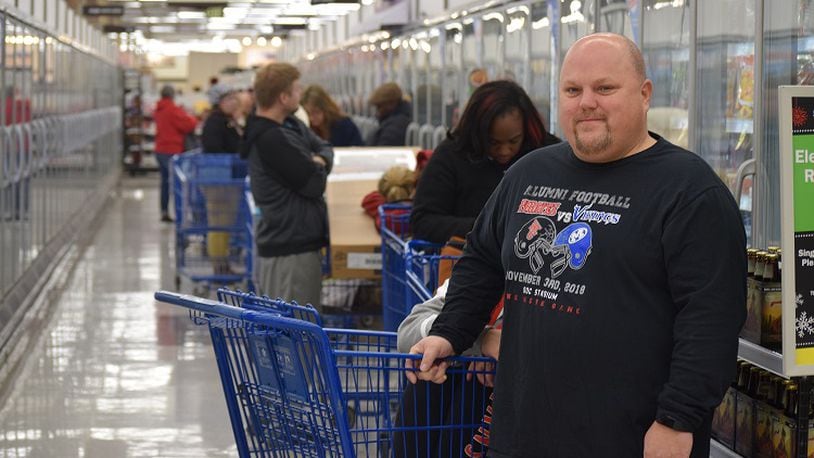 Jason Tharp of Miamisburg was first in line for the 55-inch Element TV with Roku at Meijer Thursday morning.