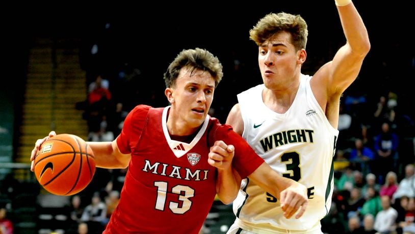 Miami's Ryan Mabrey drives past Wright State's Alex Huibregtse at the Nutter Center on Tuesday, Dec. 19, 2023. DAVID A. MOODIE/CONTRIBUTING PHOTOGRAPHER
