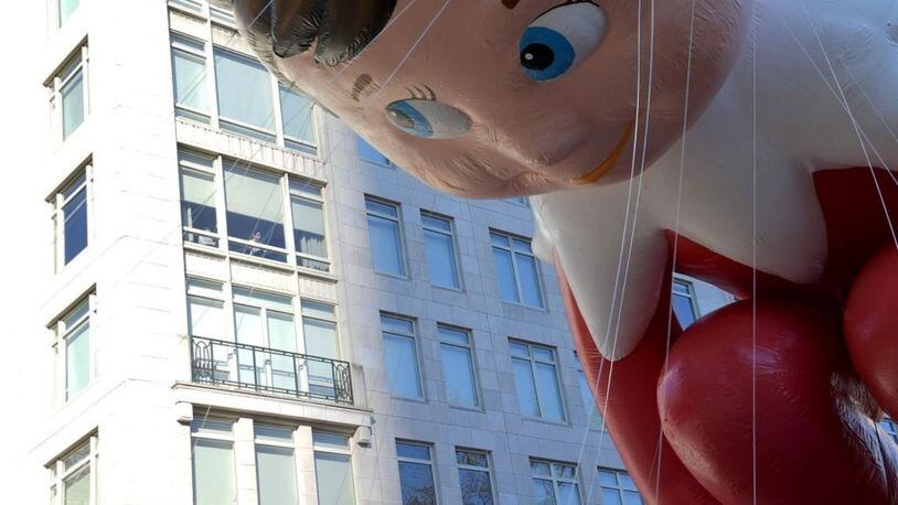 NEW YORK, NY - NOVEMBER 22: The Elf on the Shelf balloon floats along the parade route during the 2018 Macy's Thanksgiving Day Parade on November 22, 2018 in New York City.