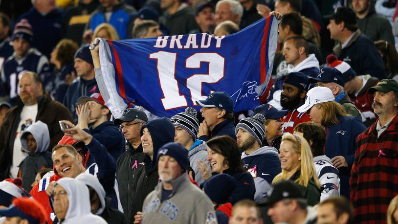FOXBORO, MA - OCTOBER 05: A fan holds a sign for Tom Brady #12 of the New England Patriots during a game against the Cincinnati Bengals at Gillette Stadium on October 5, 2014 in Foxboro, Massachusetts. (Photo by Jim Rogash/Getty Images)