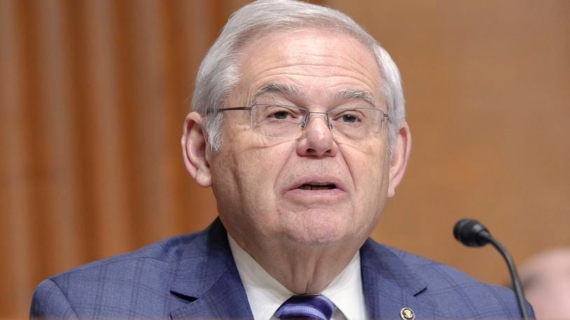 FILE - Sen. Bob Menendez, D-N.J., asks a question during a Senate Finance Committee hearing on Capitol Hill Thursday, March 14, 2024, in Washington. Menendez's bribery trial was moved forward a week to mid-May on Friday, April 18, 2024, after lawyers agreed the extra days would aid trial preparation. (AP Photo/Mariam Zuhaib, File)