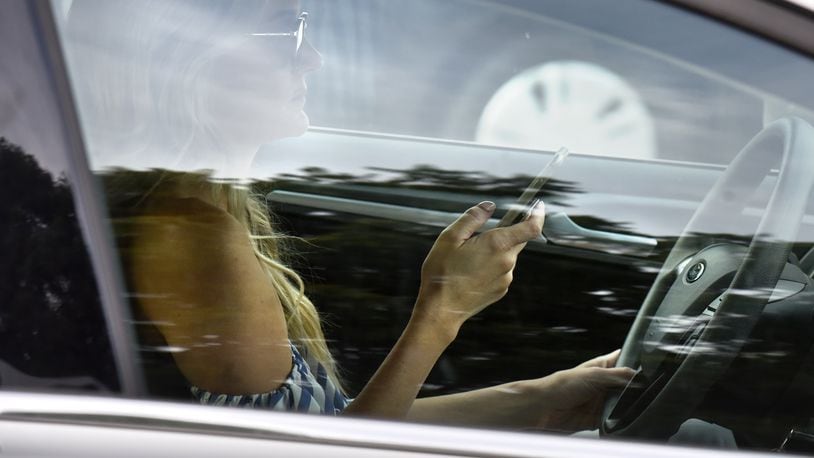 A new AAA study shows drivers who rely on adaptive cruise control and other safety technology are more likely to be distracted behind the wheel. HYOSUB SHIN / HSHIN@AJC.COM